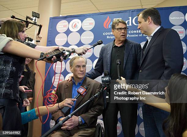 Former Texas Gov. Rick Perry and current Gov. Greg Abbott speak as Republican challenger Ted Cruz makes a final push with several Texas stops on the...