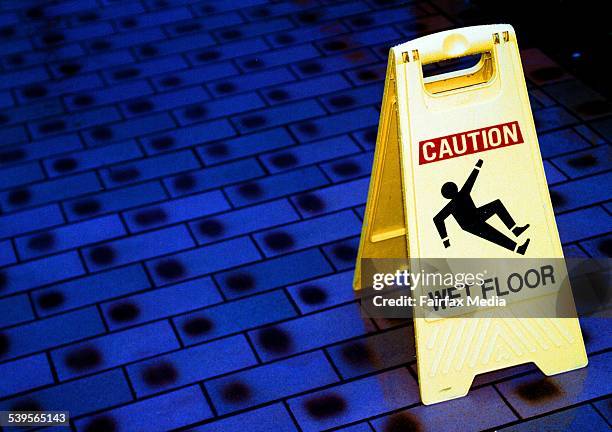 Caution sign warning of a wet floor, 15 April 2002. AFR Picture by ROB HOMER