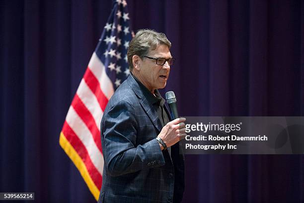 Former Texas Gov. Rick Perry warms up the crowd as Republican challenger Ted Cruz makes a final push with several Texas stops on the night before the...