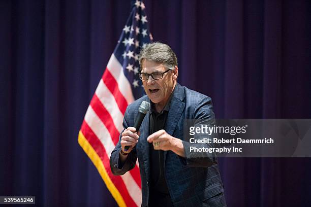 Former Texas Gov. Rick Perry warms up the crowd as Republican challenger Ted Cruz makes a final push with several Texas stops on the night before the...