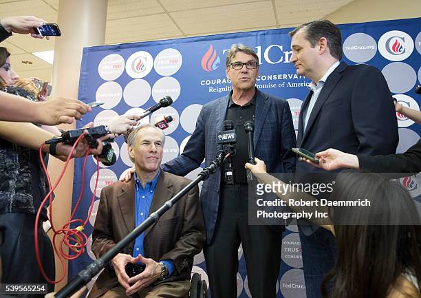 Former Texas Gov. Rick Perry and current Gov. Greg Abbott speak as Republican challenger Ted Cruz makes a final push with several Texas stops on the...
