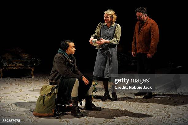Adelle Leonce as Hoskins, Amanda Lawrence as Claxton's wife and Joe Caffrey as Claxton in the National Theatre's production of Caryl Churchill's...