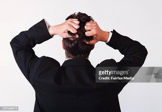 Business man tearing his hair out in frustration, 24 November 2000. AFR GENERIC Picture by GABRIELE CHAROTTE.