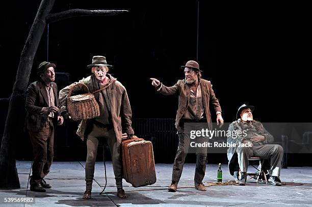 Richard Roxburgh as Estragon, Luke Mullins as Lucky, Hugo Weaving as Vladimir and Phillip Quast as Pozzo in Sydney Theatre Company's production of...