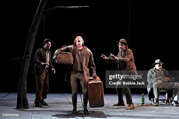 Richard Roxburgh as Estragon, Luke Mullins as Lucky, Hugo Weaving as Vladimir and Phillip Quast as Pozzo in Sydney Theatre Company's production of...