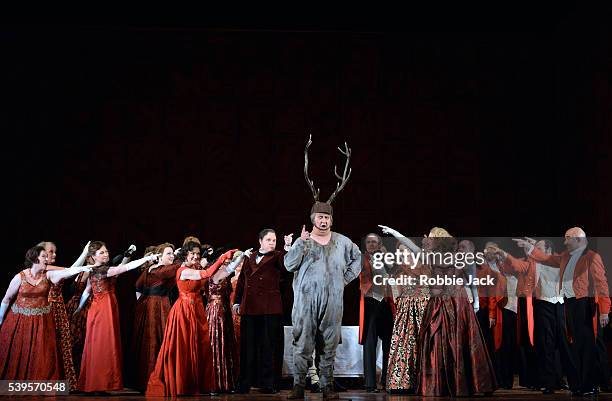 Ambrogio Maestri as Sir John Falstaff with artists of the company in the Royal Opera's production of Giuseppe Verdi's Falstaff directed by Robert...