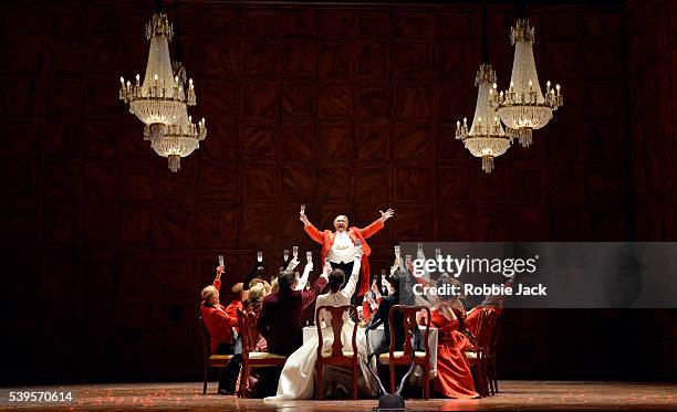 Ambrogio Maestri as Sir John Falstaff with artists of the company in the Royal Opera's production of Giuseppe Verdi's Falstaff directed by Robert...