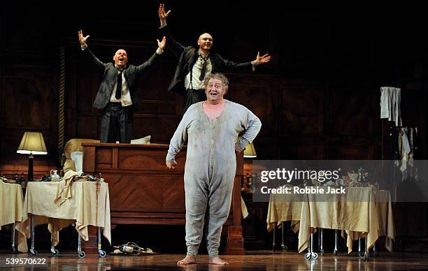 Alasdair Elliott as Bardolph, Ambrogio Maestri as Sir John Falstaff and Lukas Jakobski as Pistol in the Royal Opera's production of Giuseppe Verdi's...