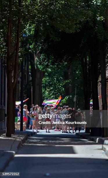 Participants of the 2016 Gay Pride Parade march through downtown on June 12, 2016 in Philadelphia, Pennsylvania. The mood was celebratory despite...