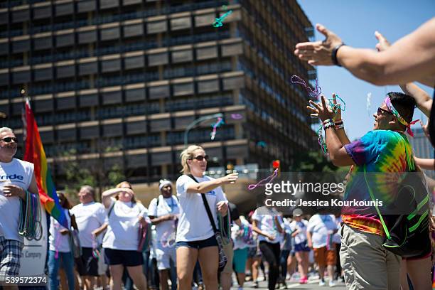 Participants of the 2016 Pride Parade march through downtown on June 12, 2016 in Philadelphia, Pennsylvania. The mood was celebratory despite news of...