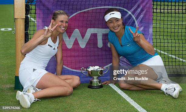 Andrea Hlavackova of Czech Republic and Shuai Peng of China with the Doubles winners trophy on day seven of the WTA Aegon Open on June 12, 2016 in...