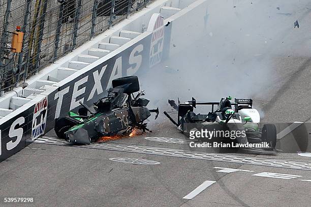 Connor Daly, driver of the Jonathan Byrd's Hospitality Honda, slides after contact with Josef Newgarden, driver of the Fuzzy's Vodka Chevrolet,...