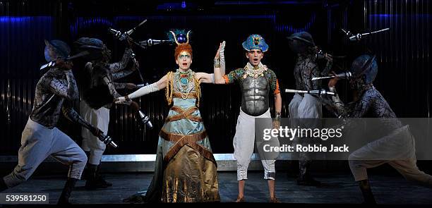 Rebecca Bottone as Queen Tye and Anthony Roth Costanzo as Akhnaten with artists of the company in the English National Opera's production of Philip...