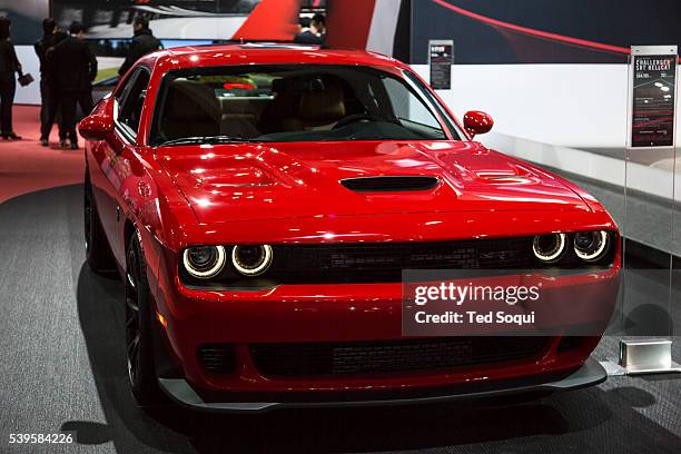 The Dodge Hellcat Challenger. Priced at $64,195 USD and produces 707hp with a semi engine. The 2015 Los Angeles Auto Show at the LA Convention Center.