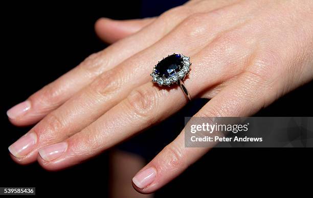 Kate Middleton, wearing her engagement ring which once belonged to Diana, Princess of Wales, on the day her engagement to Prince William was...