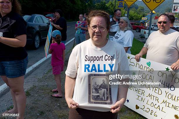 Woman at a small rally to support the coal industry wears a t-shirt with a picture of her grandfather on it, a miner who fought in the batlle at...