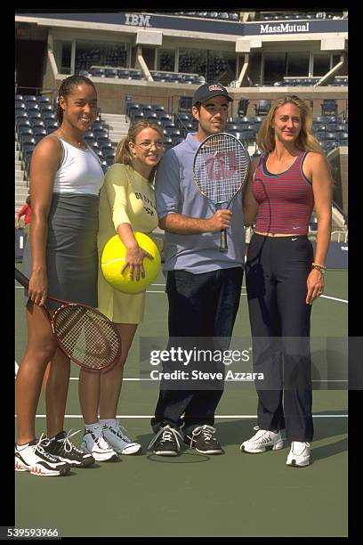 Tennis player Mary Pierce joins American television show host Carson Daly and American singer Britney Spears at the Arthur Ashe Kids' Day event in...