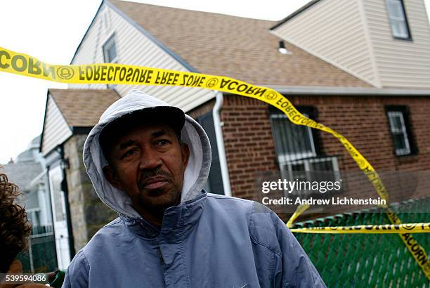 Acorn housing activists and local politicans stand in front of the foreclosed home of Myrna Millington a resident and home owner in Queens who has...