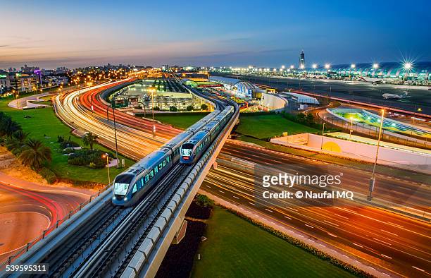 dubai metro trains crossing each other - rail transportation stock pictures, royalty-free photos & images