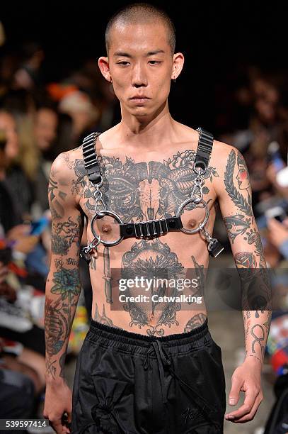 Model walks the runway at the KTZ Spring Summer 2017 fashion show during London Menswear Fashion Week on June 12, 2016 in London, United Kingdom.