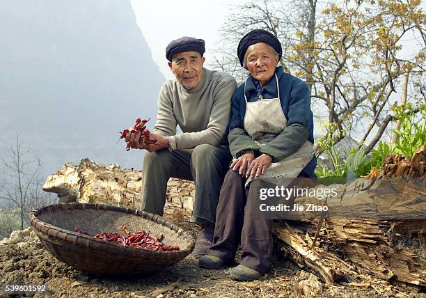 Old couple pose for photography in Hanyuan, Sichuan provice, south China on 15th March 2015. Kaijin Xiang, male, 74 years old, and Aga Shi, female,...