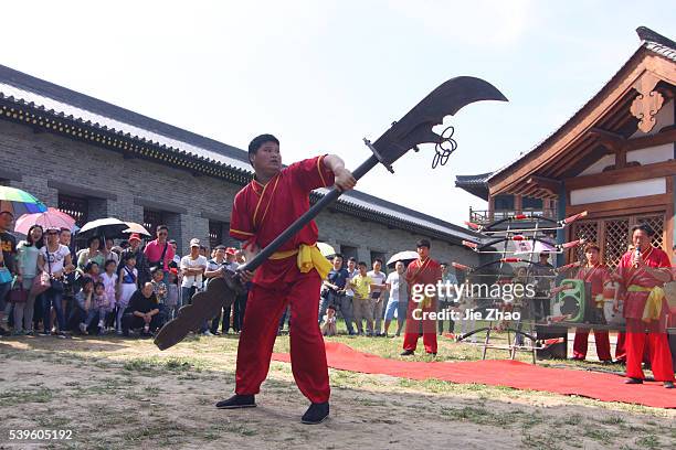 Craftmen performance to attract tourists at a new Movie and Television City in Xiangyang, Hubei province, central China Friday May 9, 2015
