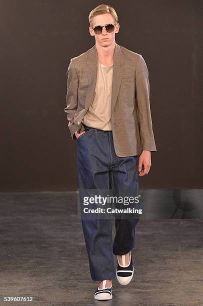 Model walks the runway at the E.Tautz Spring Summer 2017 fashion show during London Menswear Fashion Week on June 11, 2016 in London, United Kingdom.