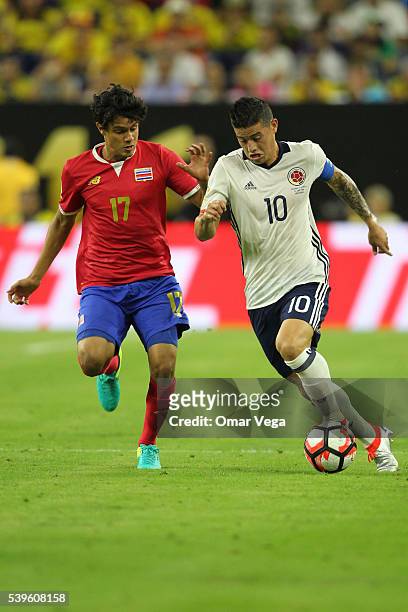 James Rodriguez of Colombia and Yeltsin Tejeda of Costa Rica fight for the ball during a group A match between Colombia and Costa Rica at NRG Stadium...