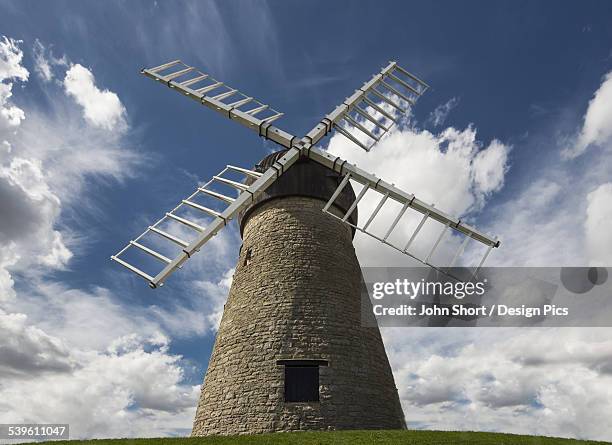 windmill against a blue sky with cloud - tyne and wear stock-fotos und bilder