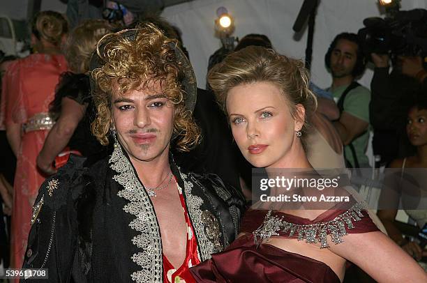 Fashion designer John Galliano and actress Charlize Theron arrive for the Metropolitan Museum of Art's Costume Institute Benefit Gala show...