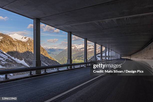 a covered highway on the side of a mountain - kanton tessin stock-fotos und bilder