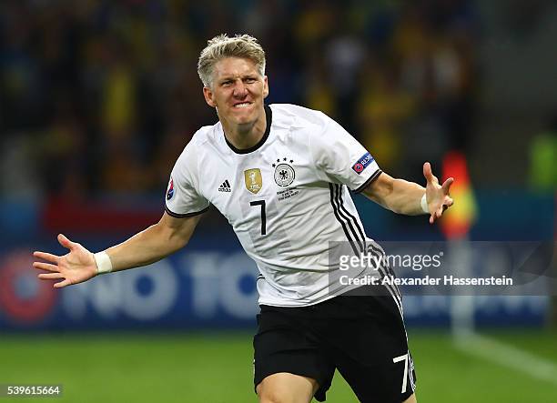 Bastian Schweinsteiger of Germany celebrates scoring his team's second goal during the UEFA EURO 2016 Group C match between Germany and Ukraine at...