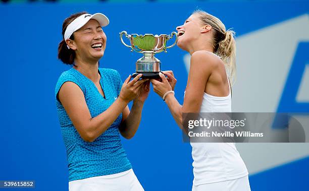 Andrea Hlavackova of Czech Republic and Shuai Peng of China with the Doubles winners trophy on day seven of the WTA Aegon Open on June 12, 2016 in...