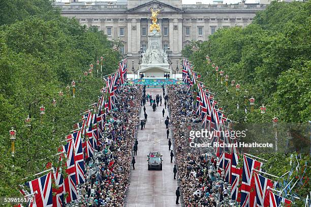Queen Elizabeth II and Prince Philip, Duke of Edinburgh take part in a parade down The Mall during 'The Patron's Lunch' celebrations for The Queen's...
