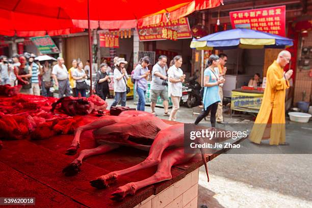 Dog bodies are put on the desk for sales at a free market ahead the Yulin Dog Eating Festival in Yulin city, south China's Guangxi Zhuang Autonomous...