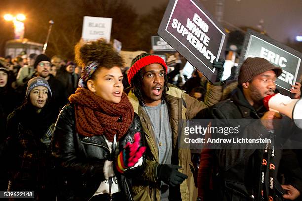 For the third night in a row, demonstrators march through the streets of New York to protest a grand jury decision not to indict a police officer for...