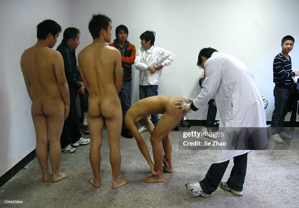 Chinese youth receive a medical examination for the People's Liberation Army in Suining, Sichuan province