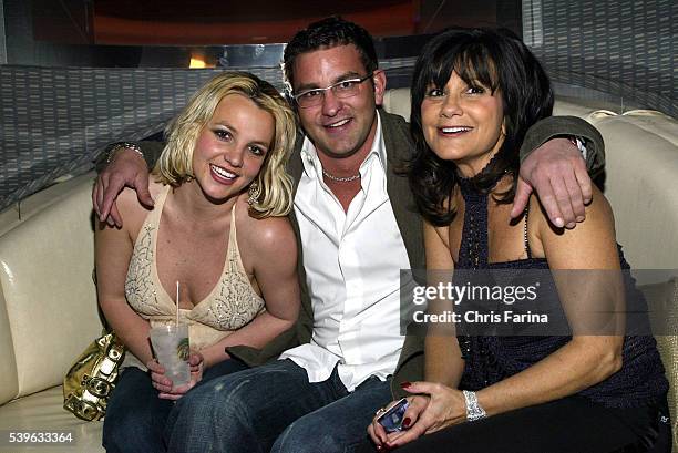 Singer Britney Spears with brother Bryan and mother Lynne celebrate with dad Jamie Spears and partners George and Phil Maloof and John Decastro, at...