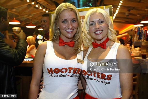Hooters girls greet guests at the Hooters Casino Hotel grand opening in Las Vegas.