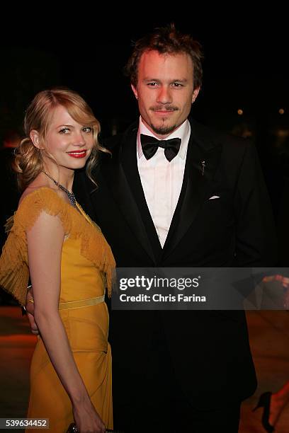 Actress Michelle Williams and partner, actor Heath Ledger arrive at the Vanity Fair Academy Awards® party at Mortons restaurant. Dress by Vera Wang....