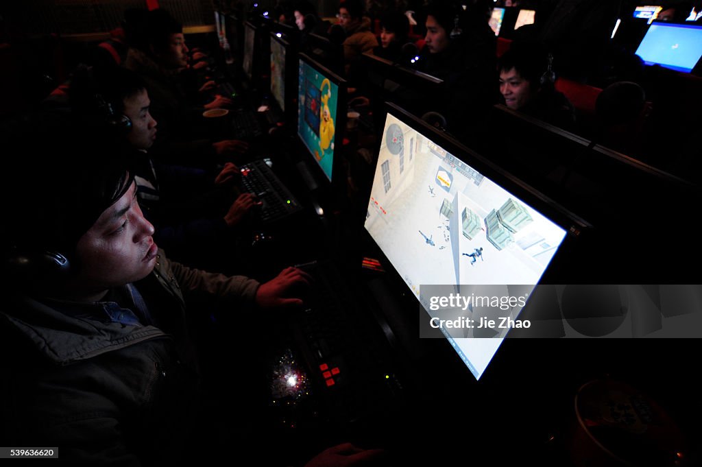 Youth play online games at an internet cafe in Hefei, Anhui province