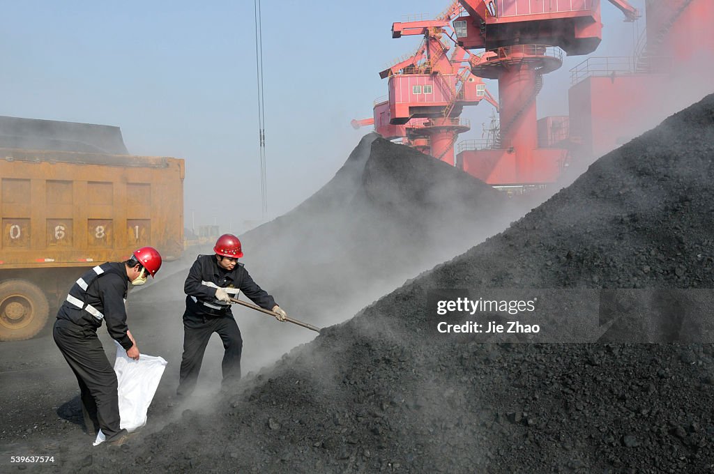 Staff members of quarantine service take a sample of coal imported from Australia in port of Rizhao