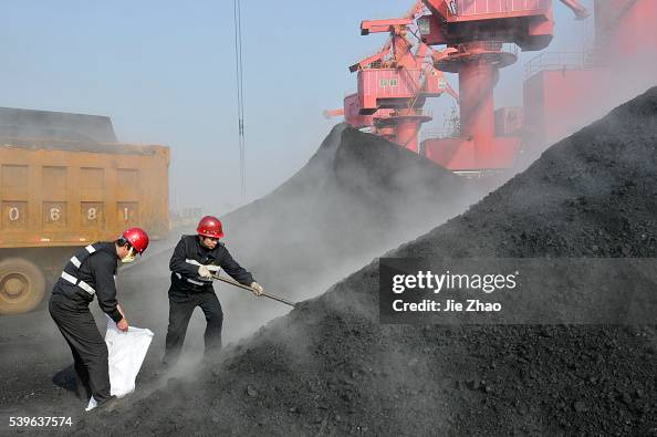 Staff members of quarantine service take a sample of coal imported from Australia in port of Rizhao Staff members of quarantine service take a sample of coal imported from Australia in port of Rizhao