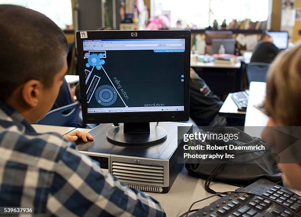 Freshman engineering students using computer-aided design and precision micrometers to duplicate parts specifications for household items at the...