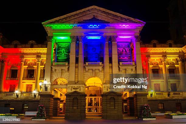 melbourne town hall, lit in rainbow colours - massacre in orlando stock pictures, royalty-free photos & images