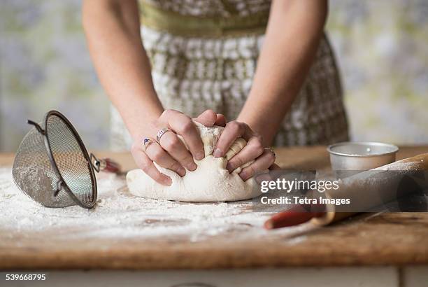 usa, new jersey, woman kneading dough - kneading stock pictures, royalty-free photos & images