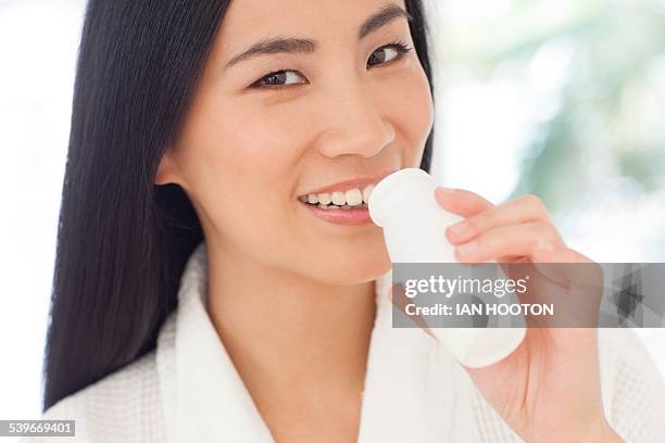 woman drinking health drink - probiotic stock pictures, royalty-free photos & images