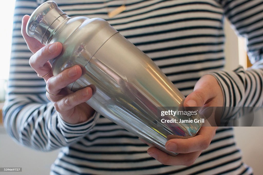 Bartender shaking cocktail