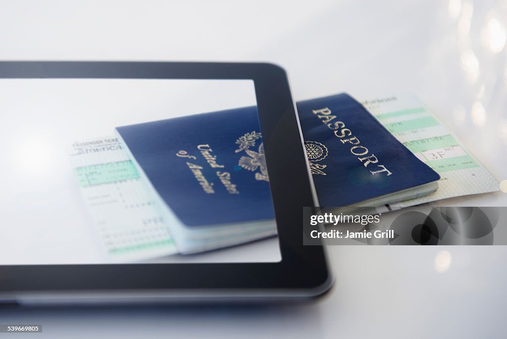 Digital tablet, airplane tickets and passport