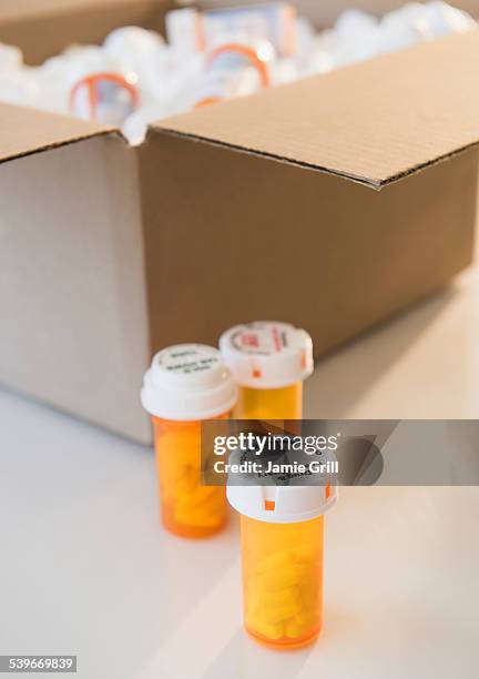 cardboard box and medicine containers - prescription home delivery stock pictures, royalty-free photos & images